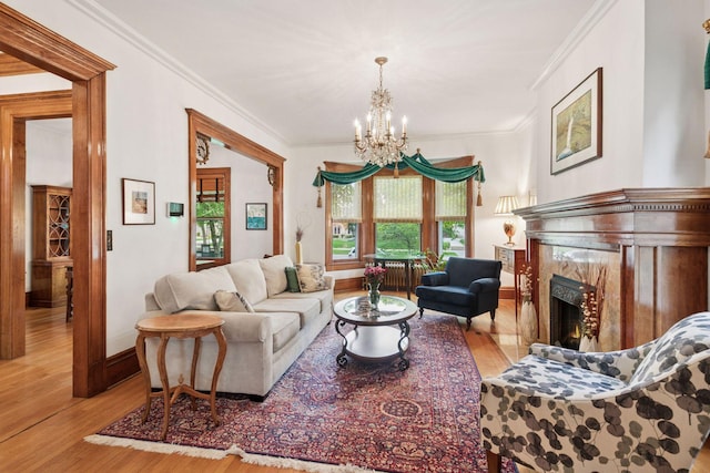 776 Summit Ave, Saint Paul, MN 55105 - living area with wood finished floors, a chandelier, crown molding, and a premium fireplace