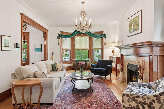 776 Summit Ave, Saint Paul, MN 55105 - living room featuring wood finished floors, a chandelier, crown molding, and a high end fireplace