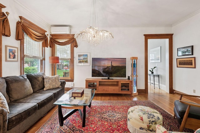 776 Summit Ave, Saint Paul, MN 55105 - living room featuring a wall unit AC, wood finished floors, a chandelier, and crown molding