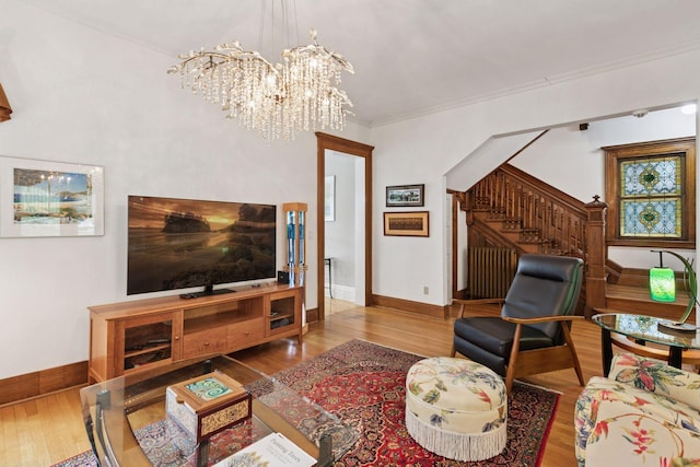 776 Summit Ave, Saint Paul, MN 55105 - living area featuring wood finished floors, a chandelier, stairs, and crown molding