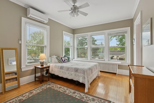 776 Summit Ave, Saint Paul, MN 55105 - bedroom with a wall unit AC, radiator heating unit, light wood-type flooring, ornamental molding, and ceiling fan