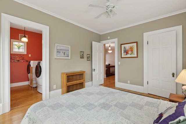 776 Summit Ave, Saint Paul, MN 55105 - bedroom featuring washing machine and clothes dryer, wood finished floors, ornamental molding, and ceiling fan