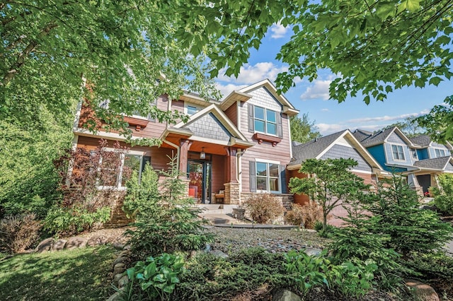 6415 Queensland Ln N, Maple Grove, MN 55311 - craftsman inspired home featuring stone siding and covered porch