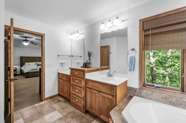 6415 Queensland Ln N, Maple Grove, MN 55311 - full bath with connected bathroom, double vanity, a garden tub, a textured ceiling, and ceiling fan