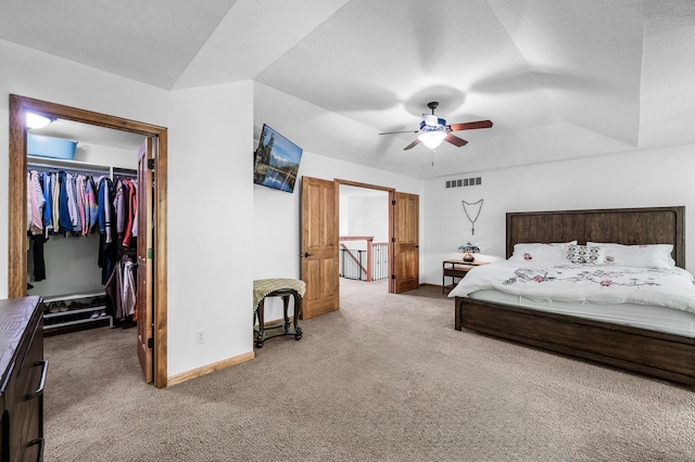 6415 Queensland Ln N, Maple Grove, MN 55311 - carpeted bedroom featuring a spacious closet, vaulted ceiling, baseboards, a closet, and a ceiling fan