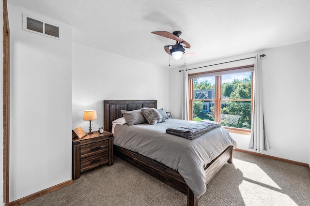 6415 Queensland Ln N, Maple Grove, MN 55311 - bedroom with carpet flooring, baseboards, ceiling fan, and a textured ceiling