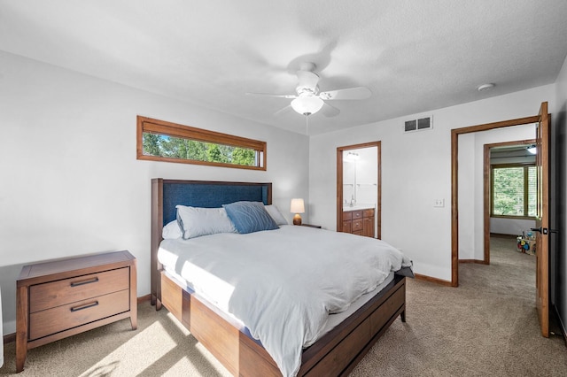 6415 Queensland Ln N, Maple Grove, MN 55311 - bedroom with carpet flooring, baseboards, ceiling fan, and connected bathroom