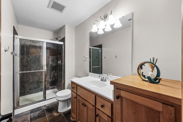 6415 Queensland Ln N, Maple Grove, MN 55311 - full bathroom featuring toilet, vanity, a shower stall, a textured ceiling, and stone finish floors