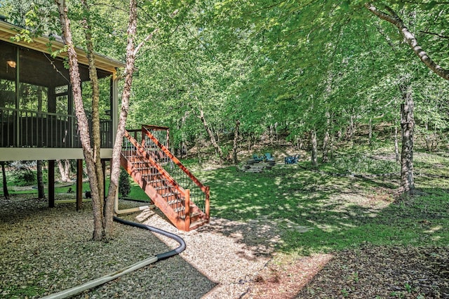 6415 Queensland Ln N, Maple Grove, MN 55311 - view of green lawn with a sunroom and stairs