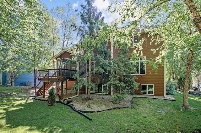 6415 Queensland Ln N, Maple Grove, MN 55311 - back of house featuring stairs, a wooden deck, and a lawn