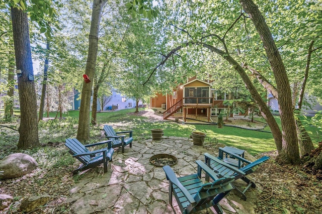 6415 Queensland Ln N, Maple Grove, MN 55311 - view of patio / terrace with a fire pit, a sunroom, and stairs