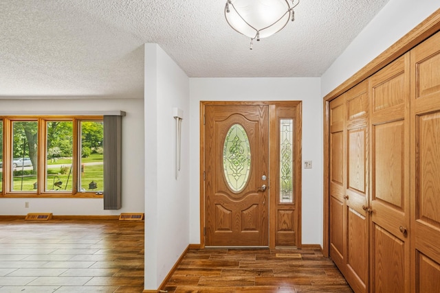 2216 146th Ave NE, Ham Lake, MN 55304 - entrance foyer with a textured ceiling and wood finished floors
