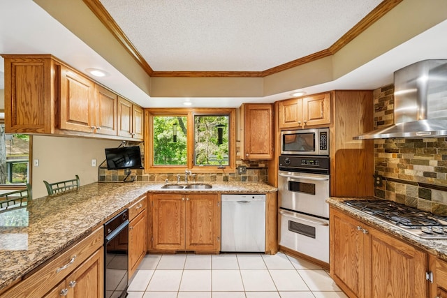 2216 146th Ave NE, Ham Lake, MN 55304 - kitchen with appliances with stainless steel finishes, wall chimney exhaust hood, crown molding, decorative backsplash, and a textured ceiling