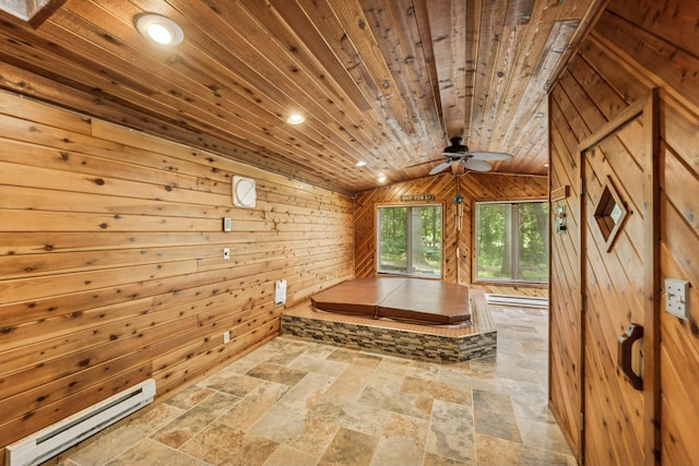 2216 146th Ave NE, Ham Lake, MN 55304 - hallway featuring a baseboard radiator, stone tile floors, wooden walls, vaulted ceiling, and wood ceiling