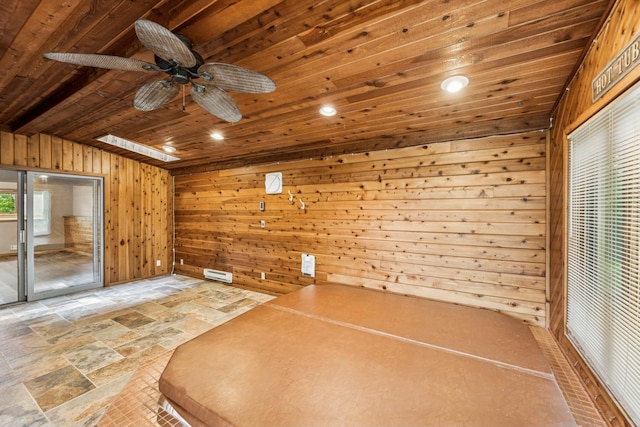 2216 146th Ave NE, Ham Lake, MN 55304 - unfurnished bedroom with wood walls, wood ceiling, access to outside, stone tile flooring, and recessed lighting