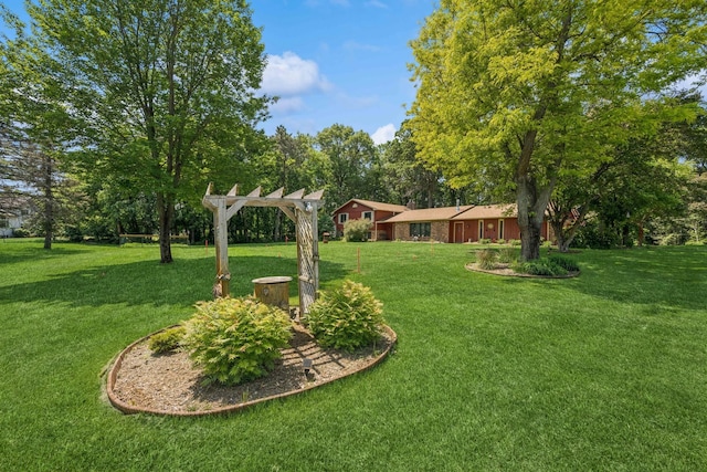 2216 146th Ave NE, Ham Lake, MN 55304 - view of green lawn featuring a pergola and view of scattered trees