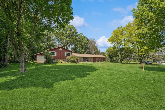 2216 146th Ave NE, Ham Lake, MN 55304 - view of green lawn featuring an attached garage