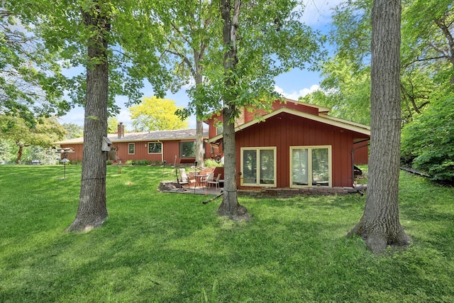 2216 146th Ave NE, Ham Lake, MN 55304 - rear view of property with a lawn and a patio