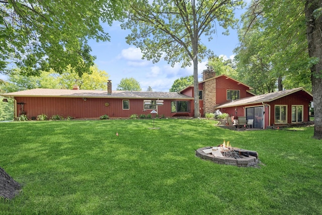 2216 146th Ave NE, Ham Lake, MN 55304 - view of grassy yard featuring an outdoor fire pit