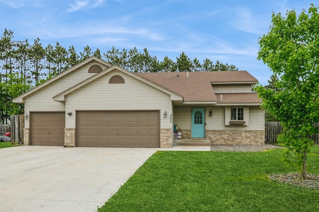 360 12th St NE, Milaca, MN 56353 - ranch-style house featuring brick siding, an attached garage, concrete driveway, and a shingled roof