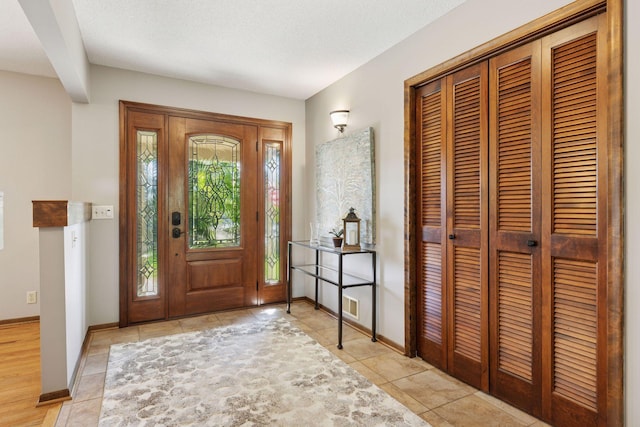 15905 43rd Ave N, Plymouth, MN 55446 - entryway featuring light tile patterned flooring and baseboards