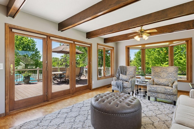 15905 43rd Ave N, Plymouth, MN 55446 - living area featuring plenty of natural light, baseboards, beam ceiling, french doors, and ceiling fan