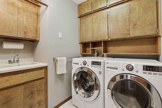 15905 43rd Ave N, Plymouth, MN 55446 - washroom with cabinet space, washing machine and clothes dryer, light tile patterned floors, and baseboards