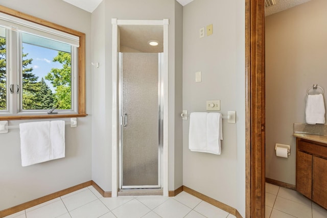 15905 43rd Ave N, Plymouth, MN 55446 - full bathroom featuring vanity, a stall shower, baseboards, and tile patterned floors