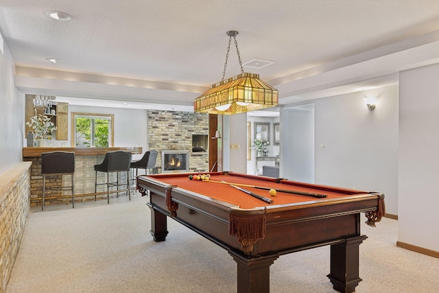 15905 43rd Ave N, Plymouth, MN 55446 - playroom with billiards table, carpet flooring, a fireplace, a dry bar, and baseboards
