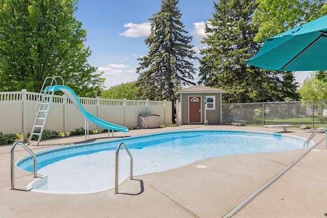 15905 43rd Ave N, Plymouth, MN 55446 - view of pool with a water slide and an outbuilding