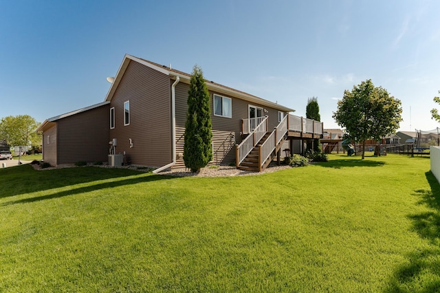 1436 Tunbridge Pl NE, Byron, MN 55920 - back of house with stairway, a wooden deck, and central AC