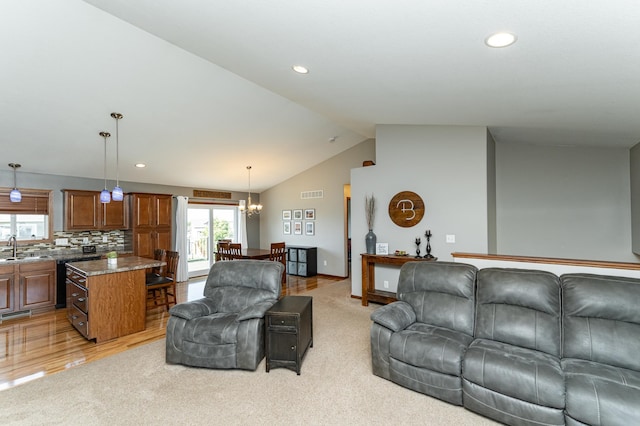 1436 Tunbridge Pl NE, Byron, MN 55920 - living room with a chandelier, lofted ceiling, light colored carpet, recessed lighting, and baseboards