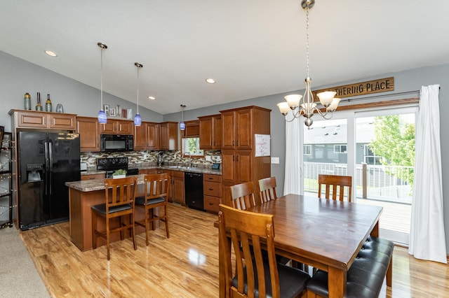 1436 Tunbridge Pl NE, Byron, MN 55920 - dining area featuring vaulted ceiling, a chandelier, light wood-type flooring, and recessed lighting