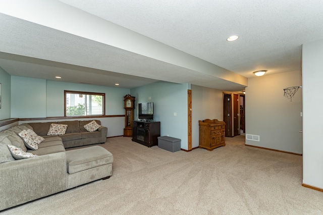 1436 Tunbridge Pl NE, Byron, MN 55920 - carpeted living area featuring baseboards, a textured ceiling, and recessed lighting