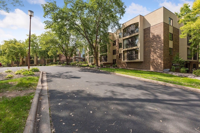 20 Windsor Ln Unit 213A, New Brighton, MN 55112 - view of asphalt street with curbs and street lighting