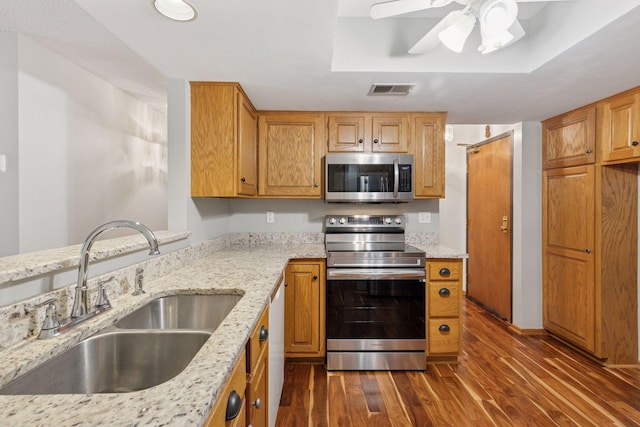 20 Windsor Ln Unit 213A, New Brighton, MN 55112 - kitchen with appliances with stainless steel finishes, a sink, dark wood-style flooring, light stone countertops, and a ceiling fan