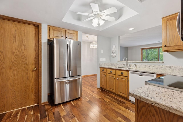 20 Windsor Ln Unit 213A, New Brighton, MN 55112 - kitchen featuring freestanding refrigerator, dishwasher, a sink, a raised ceiling, and dark wood-type flooring
