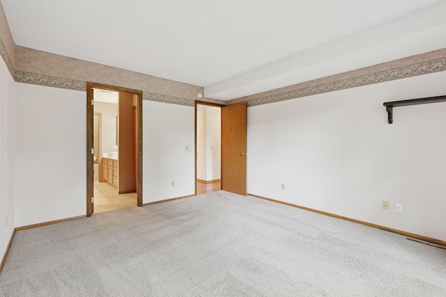 20 Windsor Ln Unit 213A, New Brighton, MN 55112 - unfurnished bedroom featuring light carpet and baseboards