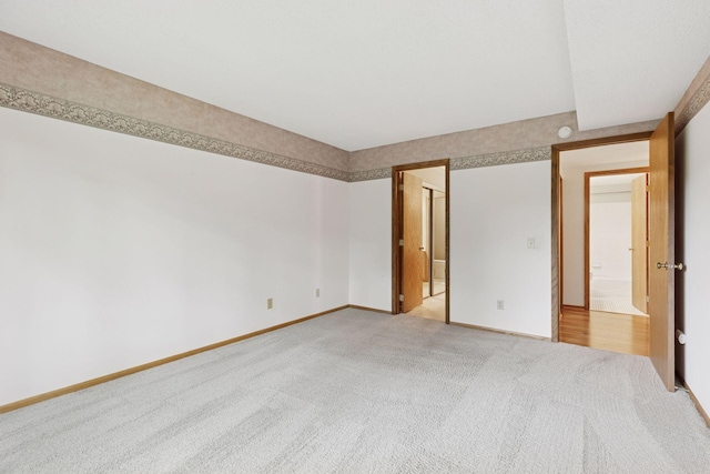 20 Windsor Ln Unit 213A, New Brighton, MN 55112 - unfurnished bedroom featuring light carpet and baseboards