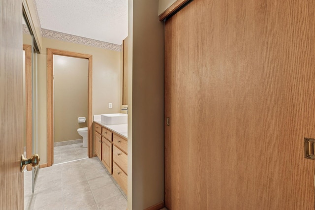 20 Windsor Ln Unit 213A, New Brighton, MN 55112 - full bathroom featuring toilet, vanity, and tile patterned flooring