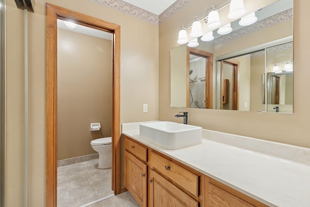 20 Windsor Ln Unit 213A, New Brighton, MN 55112 - bathroom featuring toilet, vanity, tile patterned floors, and baseboards