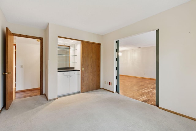 20 Windsor Ln Unit 213A, New Brighton, MN 55112 - unfurnished bedroom featuring light carpet and baseboards