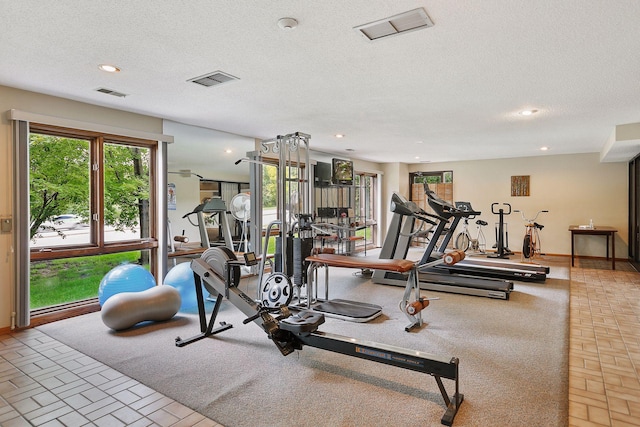 20 Windsor Ln Unit 213A, New Brighton, MN 55112 - exercise room featuring recessed lighting, a textured ceiling, baseboards, and brick patterned flooring