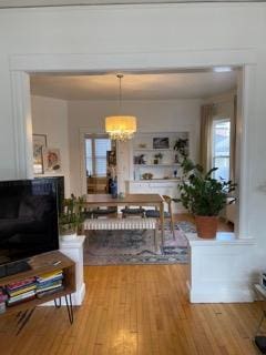 2204 Girard Ave S, Minneapolis, MN 55405 - dining room featuring a chandelier and wood finished floors