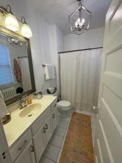 2204 Girard Ave S, Minneapolis, MN 55405 - bathroom with a chandelier, tile patterned flooring, vanity, and toilet