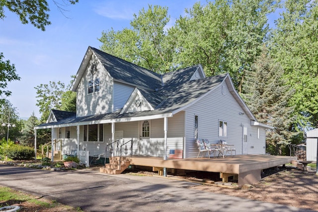 120 5th St N, Brownton, MN 55312 - view of front of home featuring covered porch and a shingled roof