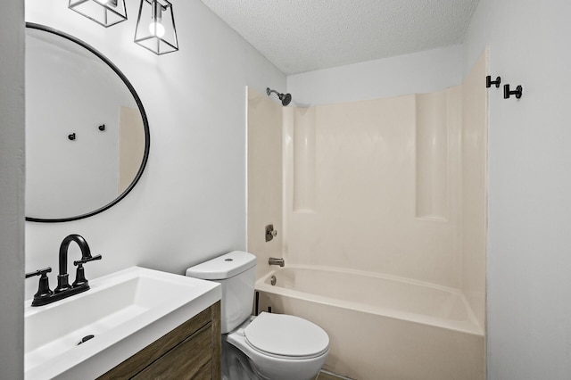 26 10th St W Unit 1108, Saint Paul, MN 55102 - bathroom with a textured ceiling, toilet, vanity, and tub / shower combination