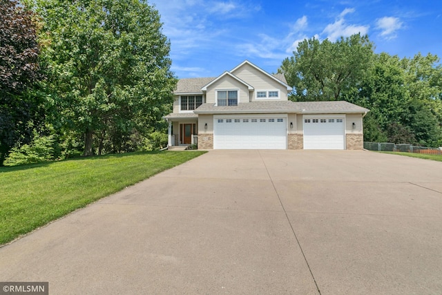2119 13th Ave E, North Saint Paul, MN 55109 - traditional home with concrete driveway, a garage, brick siding, and roof with shingles