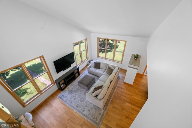 2119 13th Ave E, North Saint Paul, MN 55109 - living room featuring vaulted ceiling and wood finished floors