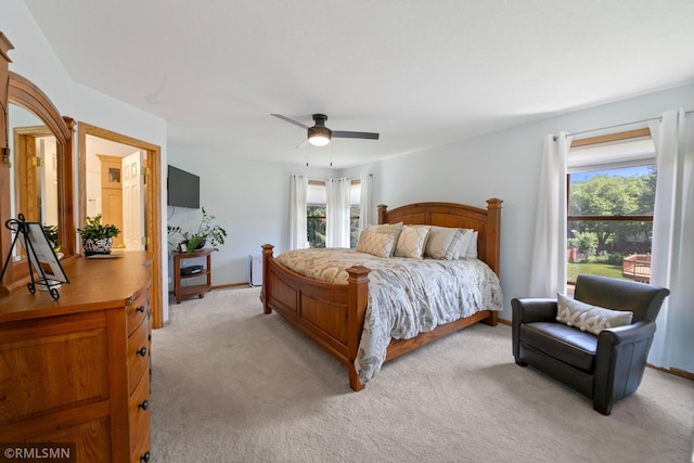2119 13th Ave E, North Saint Paul, MN 55109 - bedroom with light carpet and a ceiling fan